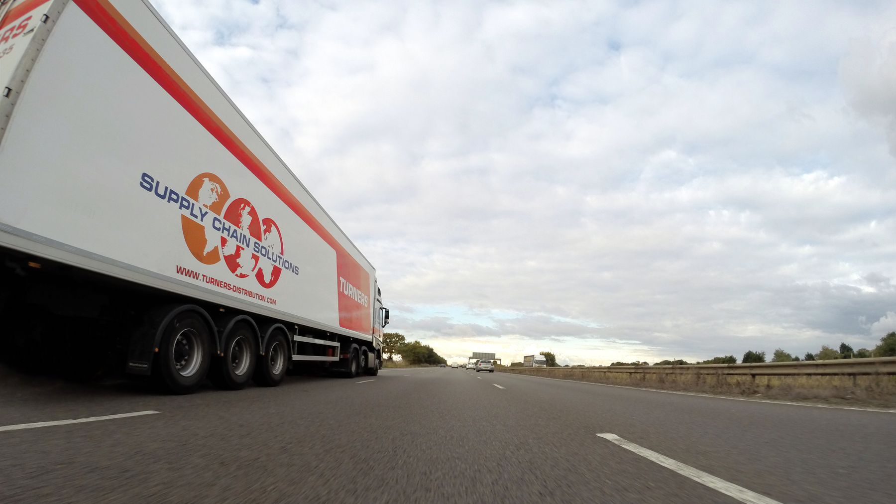 Heavy articulated lorry travelling along a highway